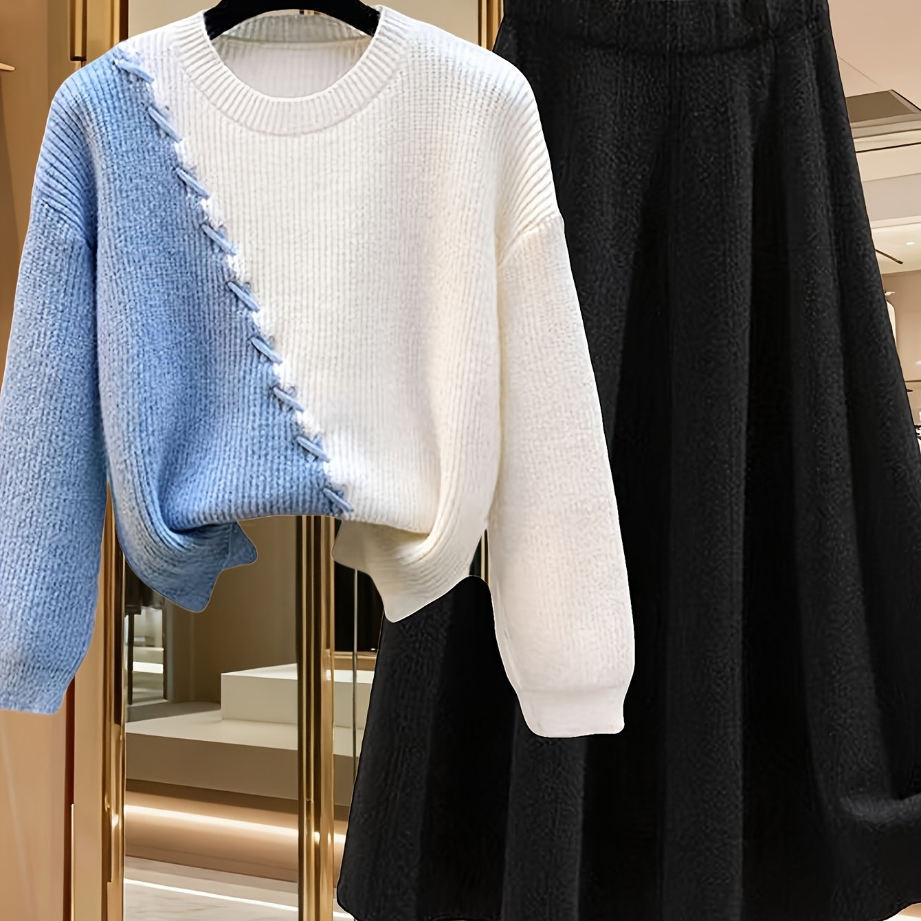 طقم نسائي من قطعتين من ملابس التريكو لفصلي الخريف والشتاء - بلوزة عصرية مع تنورة فضفاضة