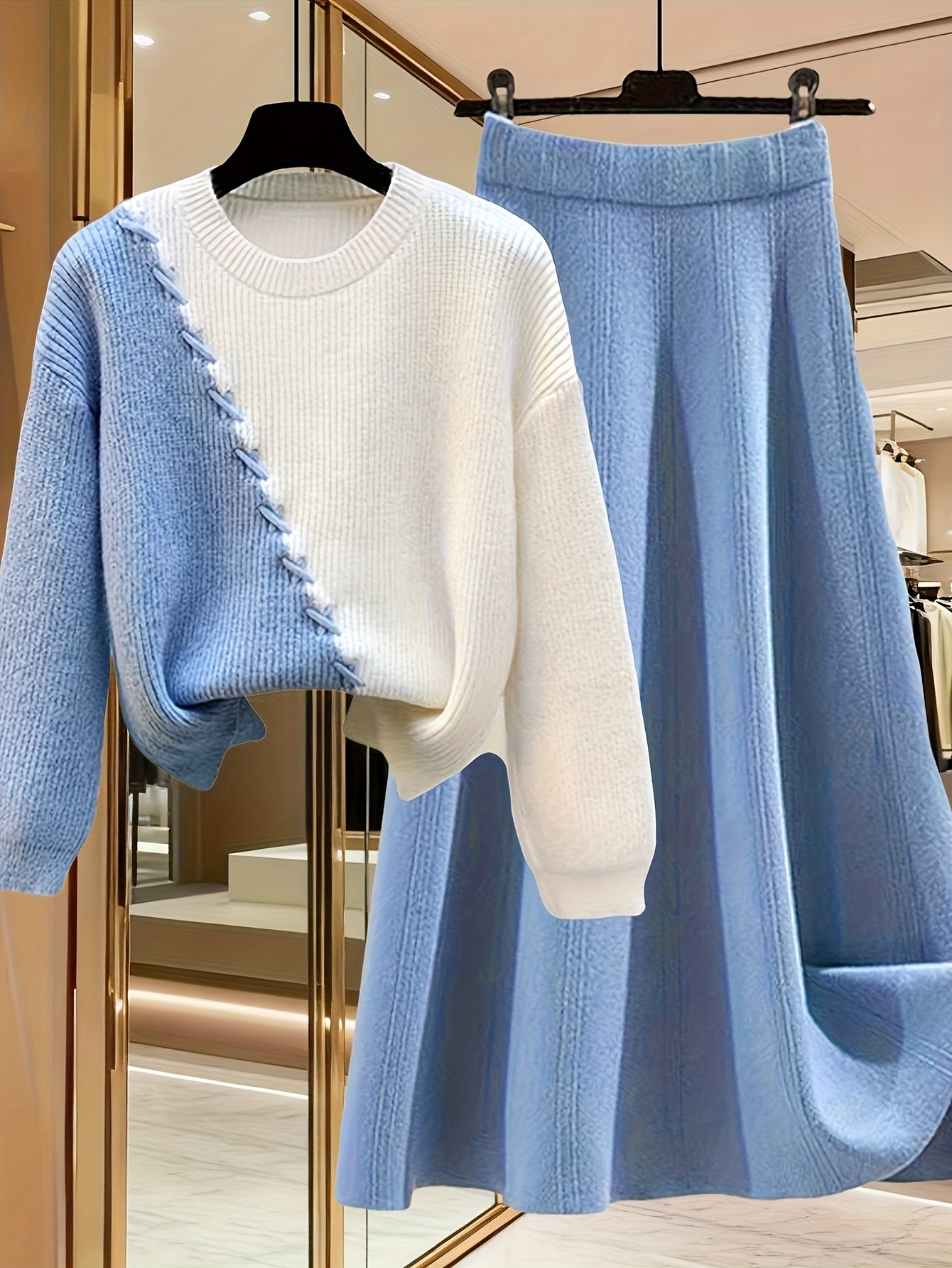 طقم نسائي من قطعتين من ملابس التريكو لفصلي الخريف والشتاء - بلوزة عصرية مع تنورة فضفاضة