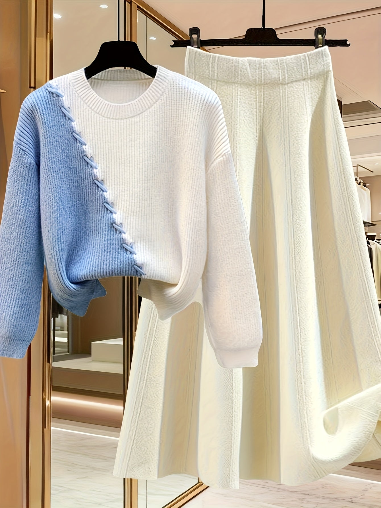 طقم نسائي من قطعتين من ملابس التريكو لفصلي الخريف والشتاء - بلوزة عصرية مع تنورة فضفاضة