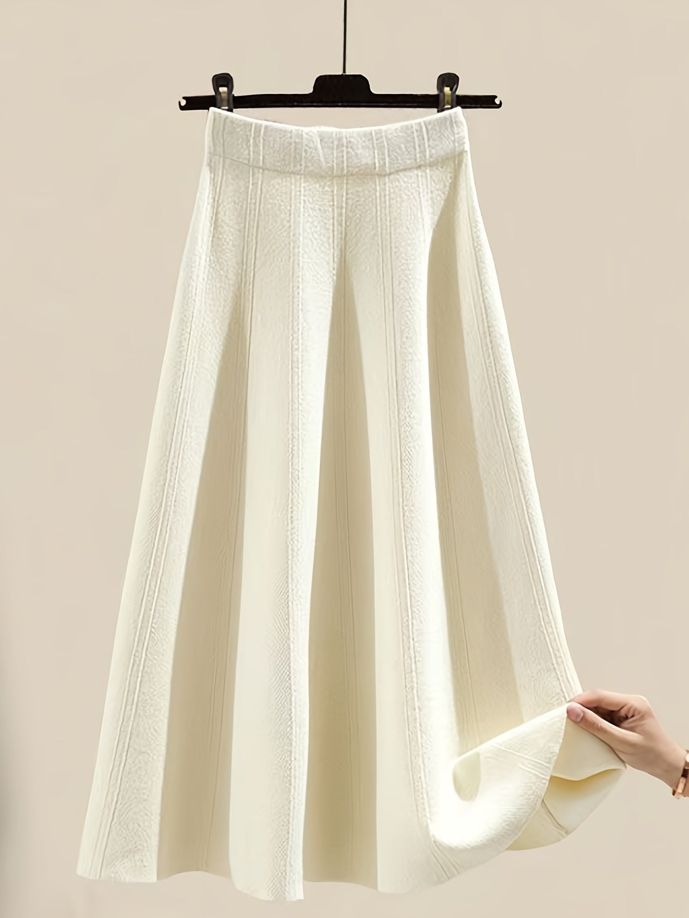 طقم نسائي من قطعتين من ملابس التريكو لفصلي الخريف والشتاء - بلوزة عصرية مع تنورة فضفاضة