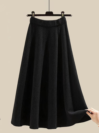 طقم نسائي من قطعتين من ملابس التريكو لفصلي الخريف والشتاء - بلوزة عصرية مع تنورة فضفاضة