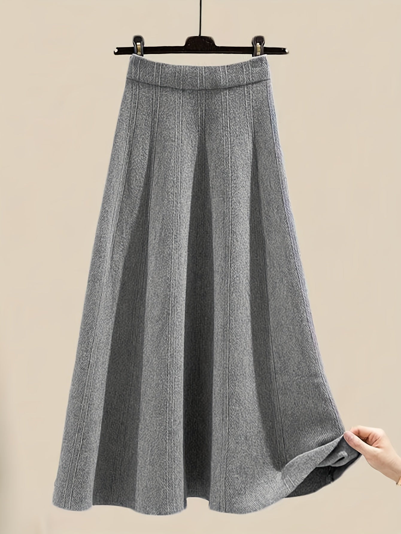 طقم نسائي من قطعتين من ملابس التريكو لفصلي الخريف والشتاء - بلوزة عصرية مع تنورة فضفاضة