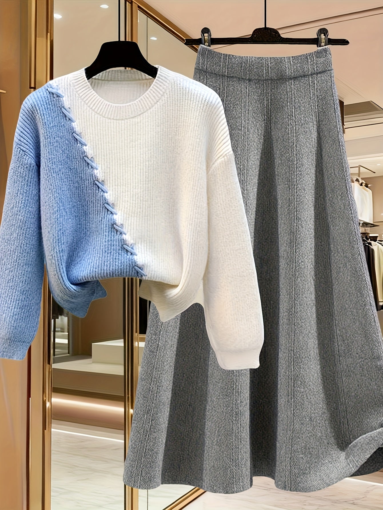 طقم نسائي من قطعتين من ملابس التريكو لفصلي الخريف والشتاء - بلوزة عصرية مع تنورة فضفاضة